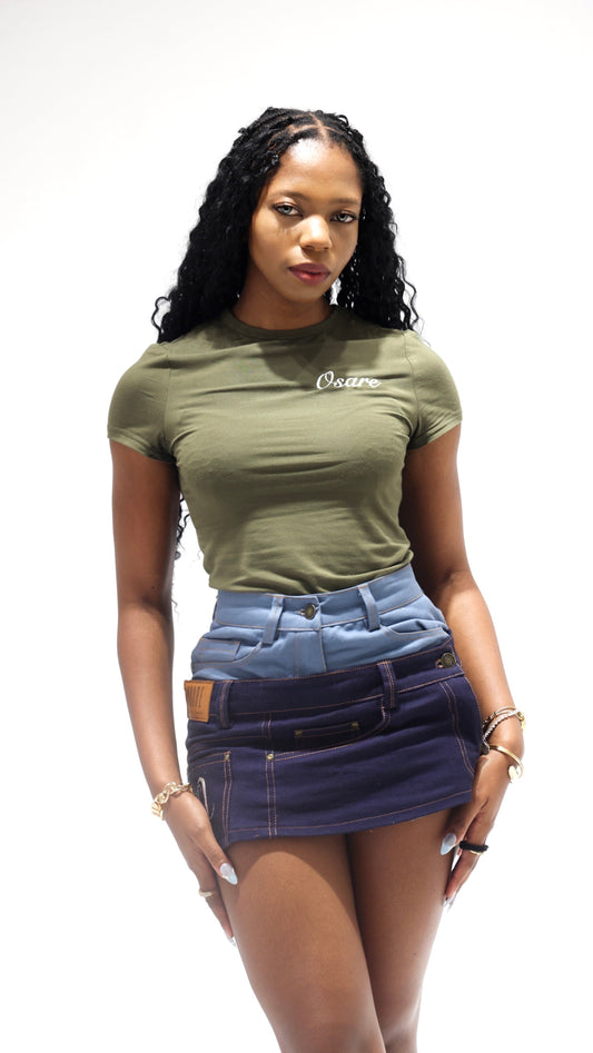 Woman wearing a green t-shirt and denim skirt on a white background